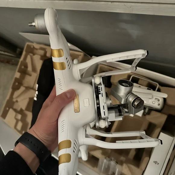 DJI White and Gold Drone with Controller